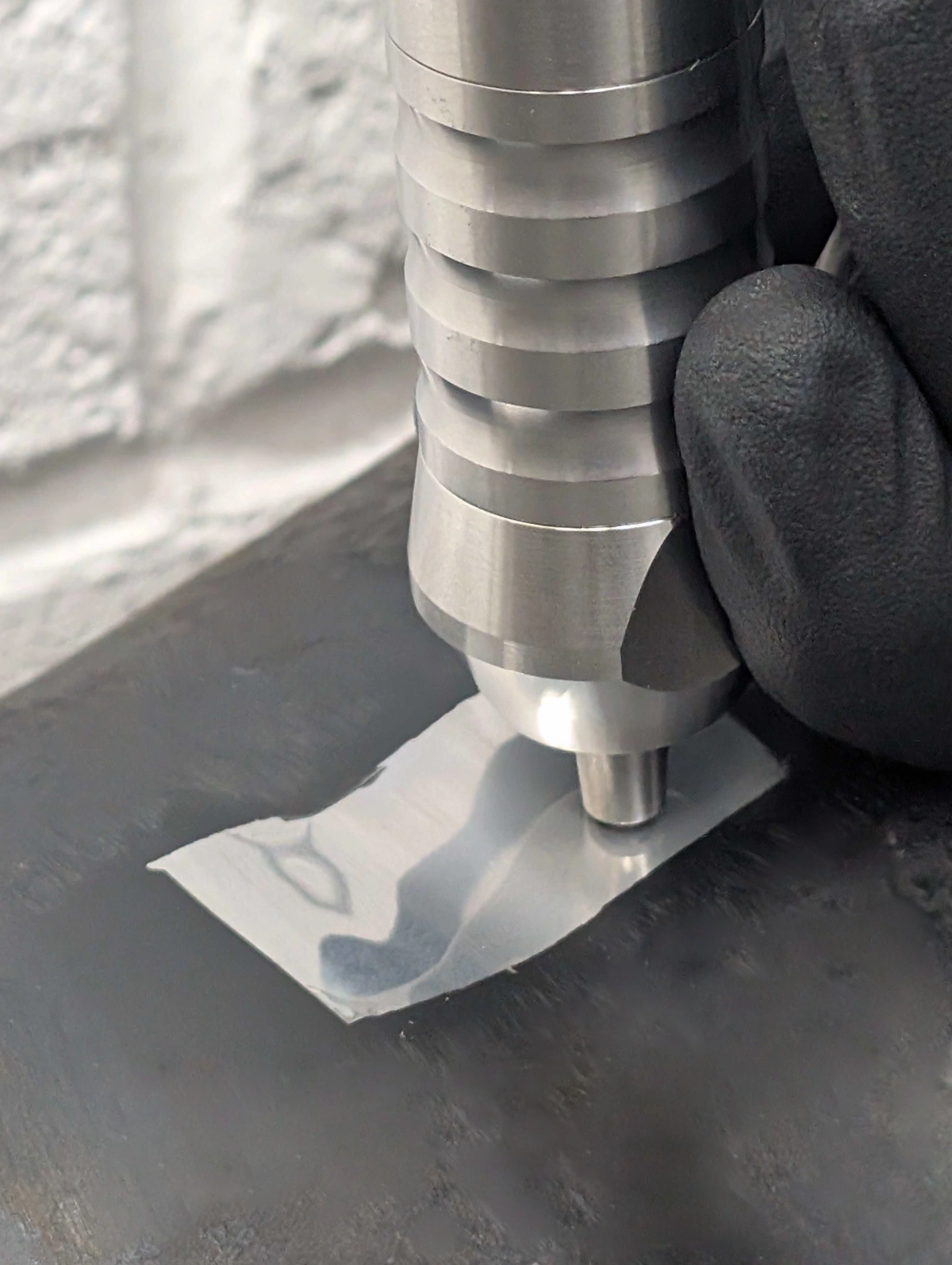 A UCI hardness indenter The functional diamond tipped end of an in-situ hardness tester