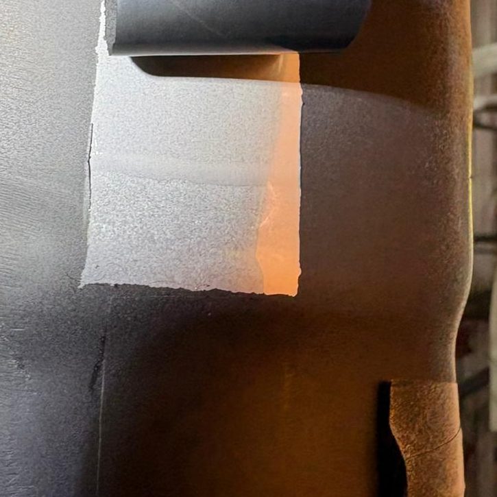 High-Resolution Microstructural Replication. Removal of a metallographic replica from a pipe surface, capturing the microstructure of the weld, HAZ, and parent material.